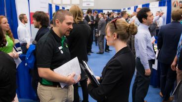 A Mines student talks to a recruiter at Spring 2018 Career Day