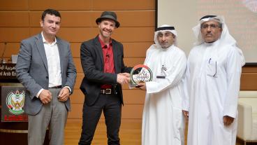 Lincoln Carr, second from left, receives an award from UAE University