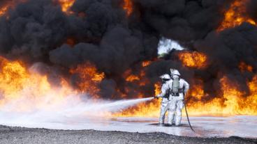 Firefighters use one of the P-34 Rapid Intervention Vehicle’s two 200-foot, one-inch hand lines to train on deployment techniques