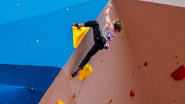 Martin Kuhnel competing in the World University Sport Climbing Championships.