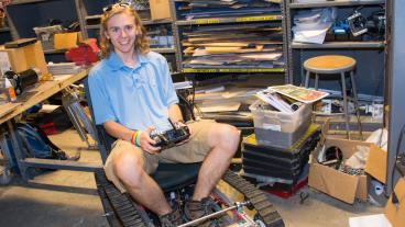 Mines student sitting in automated tank base