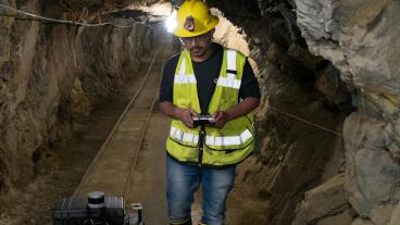 A Mines graduate student works with a robot inside the Edgar Experimental Mine in Idaho Springs.