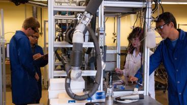 Dr. Carolyn Koh, second from right, in the Center for Hydrate Research lab with her research team.