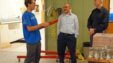 Luke Frash and Marte Gutierrez visit a DOE lab.