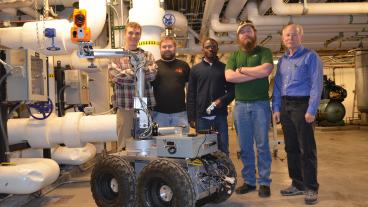 Alex Yearsly, Marshall Sweatt, Adewole Ayoade, John Steuben and Dr. John Steele with Blaster.