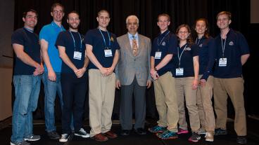 TMS President Hani Henein poses with the winning Mines team.