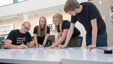 Mines' newest University Innovation Fellows in one of the maker spaces on campus.