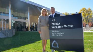 Michael and Patty Starzer ’83 in front of the new building.
