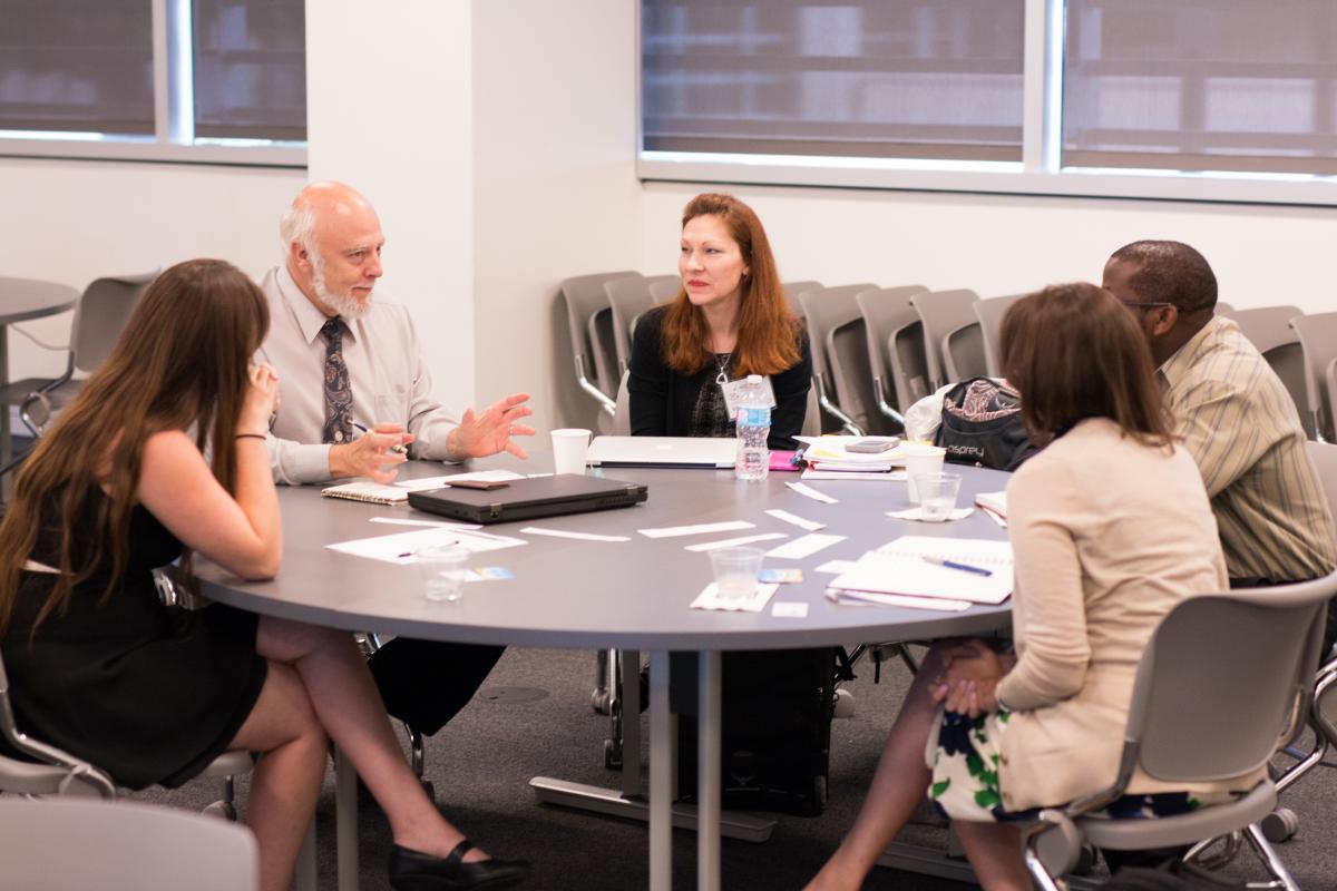 Faculty students and industry members brainstorm strategies for increasing CSR education for engineers.