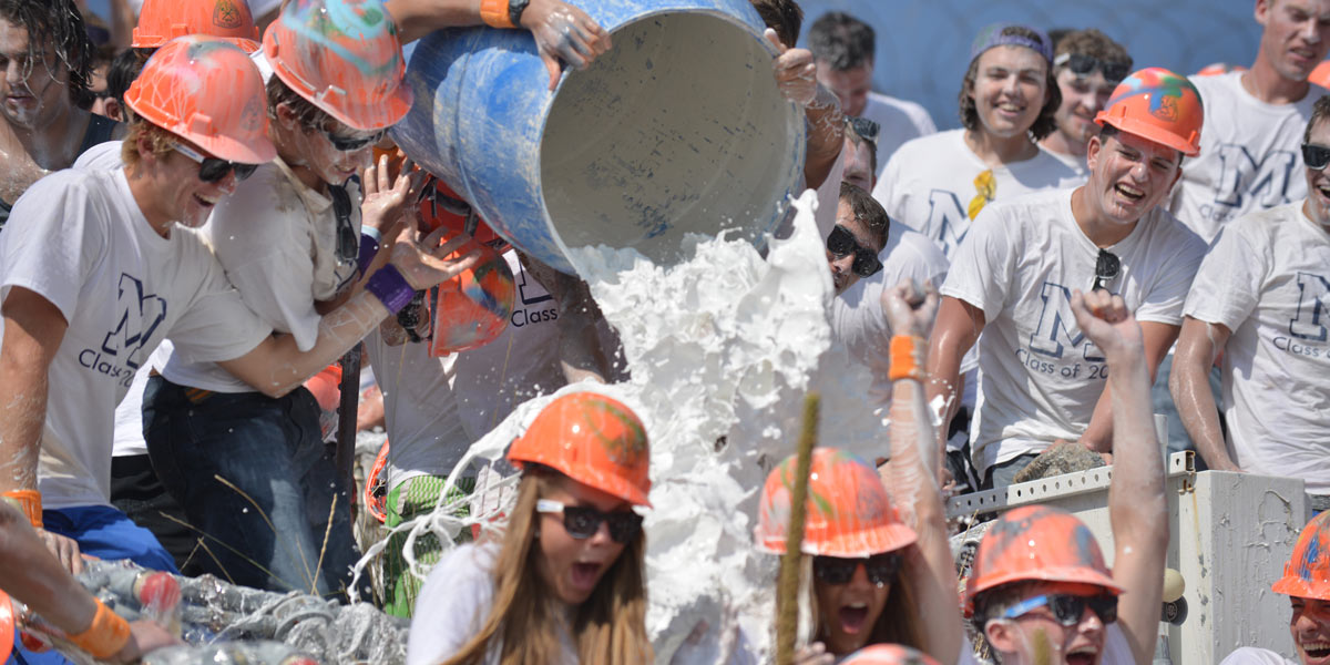 Some traditions never change. Former and current students participate in the annual M Climb, which includes getting covered with whitewash.